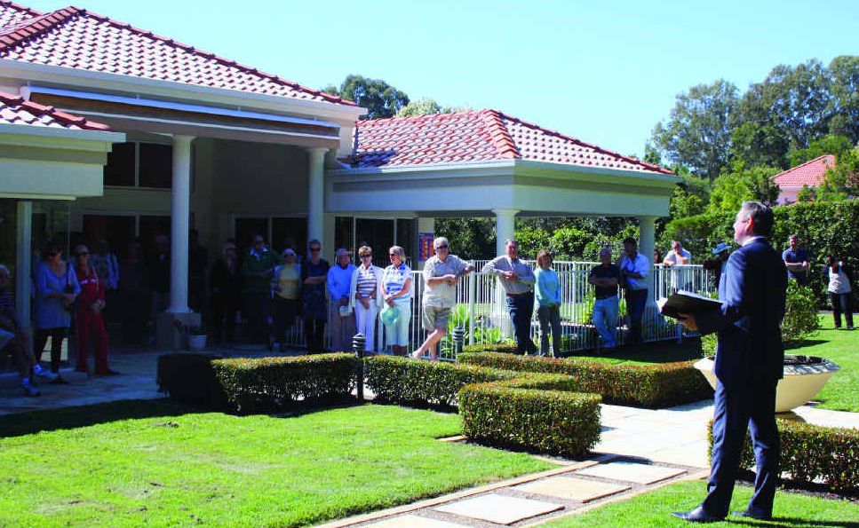 Auctioneer Michael Hughes bids a crowd of about 40 welcome at 7 Habitat Pl, Noosa Heads, on Saturday. The five-bedroom home is being marketed by Sam Plummer and Karen Bester of Dowling & Neylan Photo: Erle Levey Auctioneer Michael Hughes bids a crowd of about 40 welcome at 7 Habitat Pl, Noosa Heads, on Saturday. The five-bedroom home is being marketed by Sam Plummer and Karen Bester of Dowling & Neylan Photo: Erle Levey