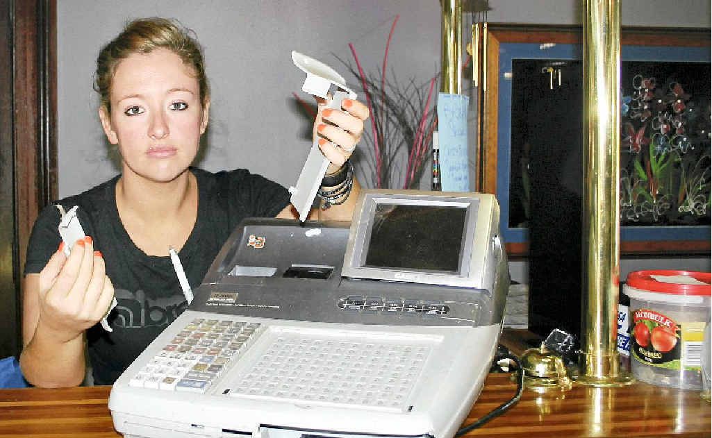 Elli Sundstrom of Zeebras Restaurant and Cafe at Casino picking up the pieces of her cash register after thieves broke into the business. Elli Sundstrom of Zeebras Restaurant and Cafe at Casino picking up the pieces of her cash register after thieves broke into the business.
