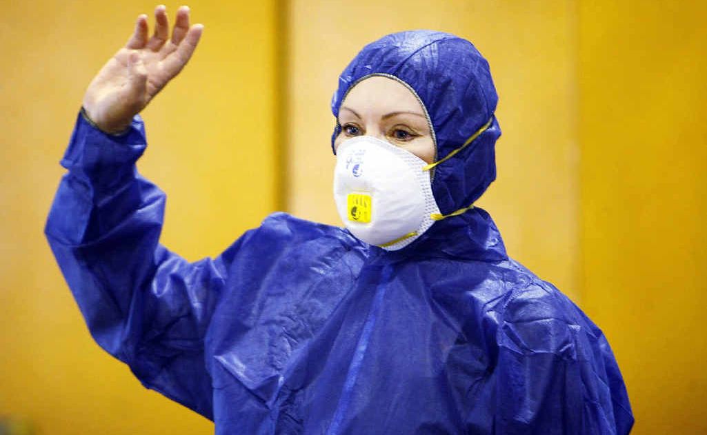Patricia Petersen in a protective suit and mask addresses a small gathering to discuss their concerns about the impact of the expansion of the New Chum dump. Patricia Petersen in a protective suit and mask addresses a small gathering to discuss their concerns about the impact of the expansion of the New Chum dump.