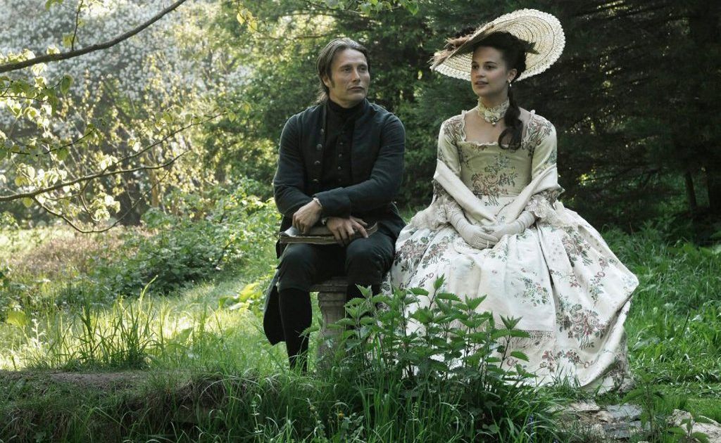 Mads Mikkelsen and Alicia Vikander in a scene from the movie A Royal Affair. Mads Mikkelsen and Alicia Vikander in a scene from the movie A Royal Affair.