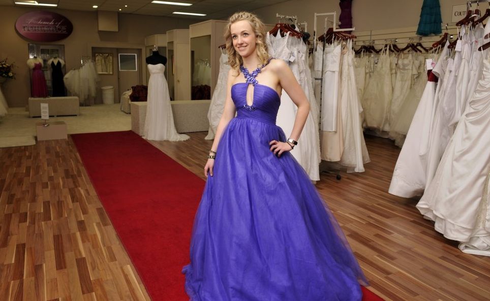Keely Lister from Acqinas Hair Design models a ball gown worth $899.95. Keely Lister from Acqinas Hair Design models a ball gown worth $899.95.