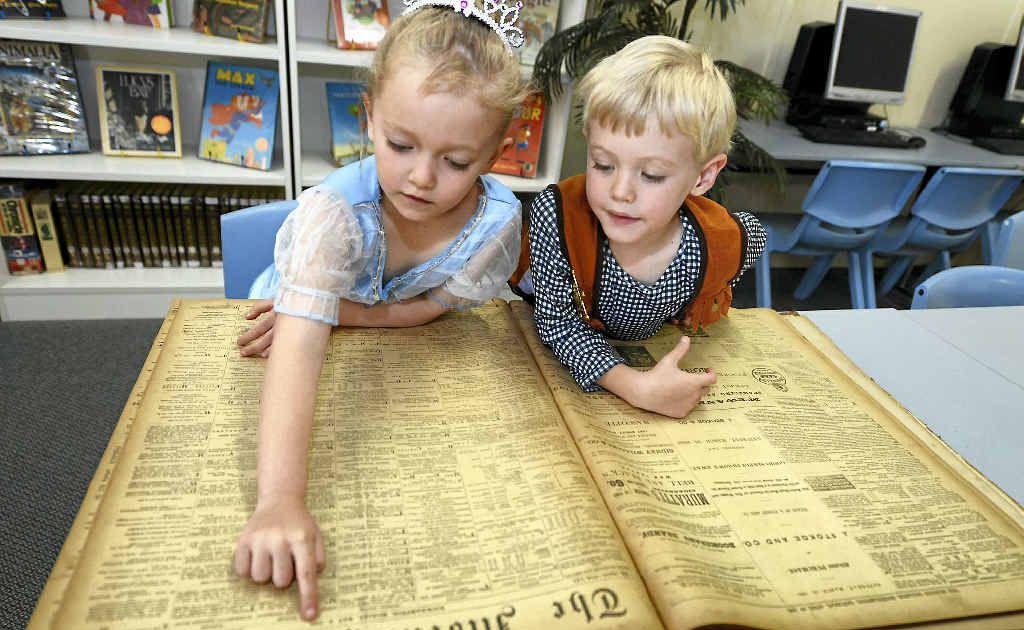 Jasmin Maycock and Alex Winter, both 5 and in prep at Depot Hill State School, find lots of interest in old editions of The Morning Bulletin that were found in the school’s storage area. Jasmin Maycock and Alex Winter, both 5 and in prep at Depot Hill State School, find lots of interest in old editions of The Morning Bulletin that were found in the school’s storage area.