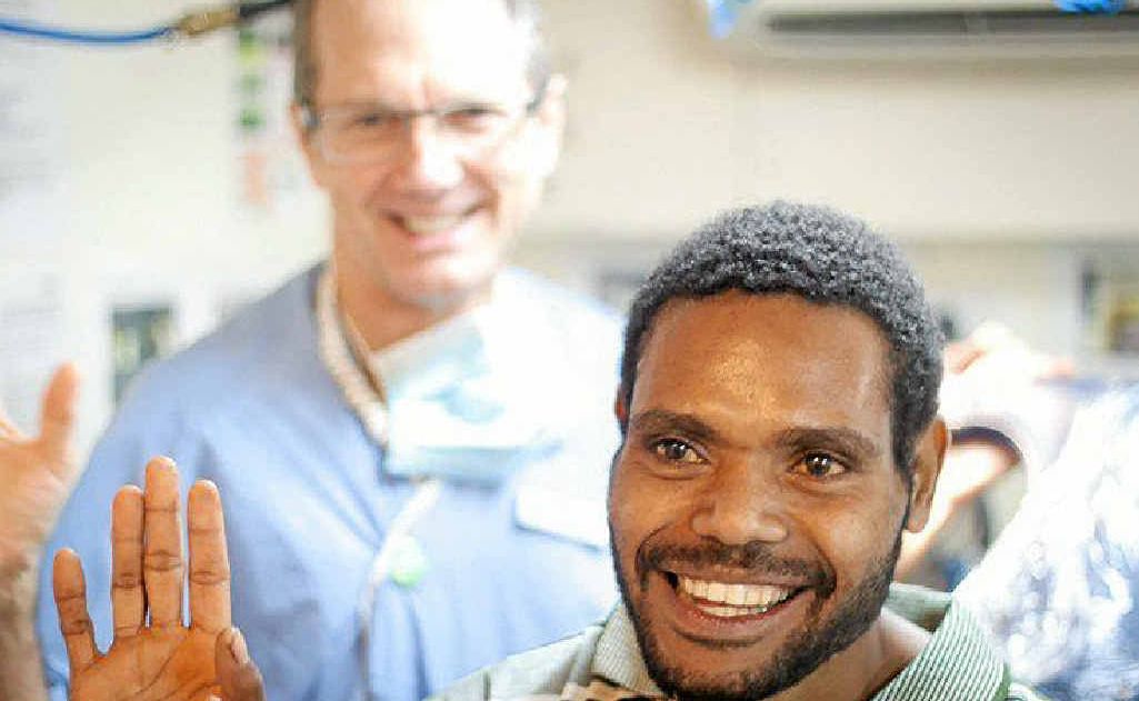 SMILES ALL ROUND: Alstonville dentist John Philips with a PNG patient. SMILES ALL ROUND: Alstonville dentist John Philips with a PNG patient.