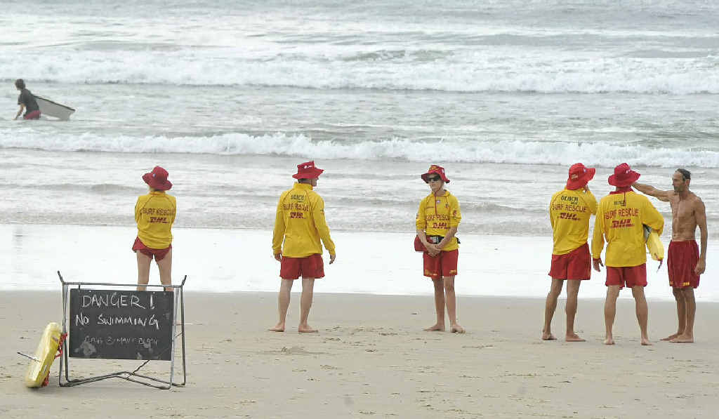 Signs warning of dangerous surf conditions at Main Beach Byron Bay on the last day of the school holidays. Surf lifesavers were warning people to only swim between the flags. Signs warning of dangerous surf conditions at Main Beach Byron Bay on the last day of the school holidays. Surf lifesavers were warning people to only swim between the flags.