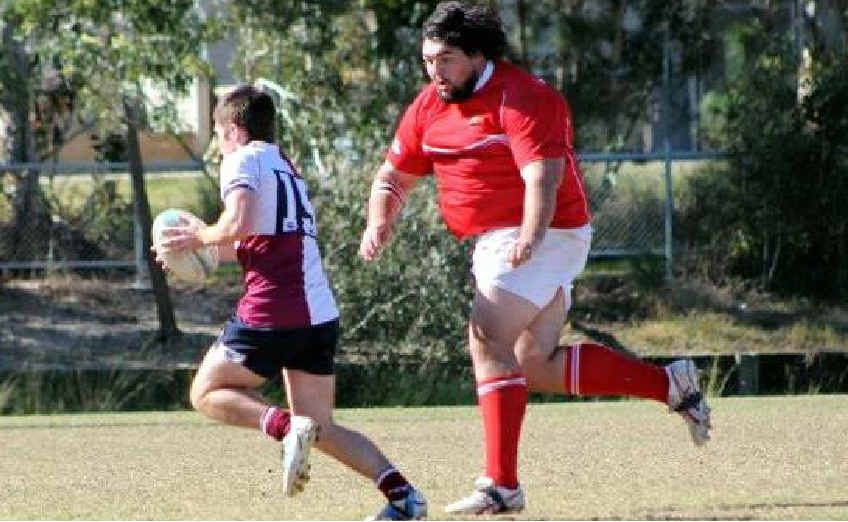 Ryan Frisby takes on a Nambour player in the reserve-grade semi-final. Ryan Frisby takes on a Nambour player in the reserve-grade semi-final.
