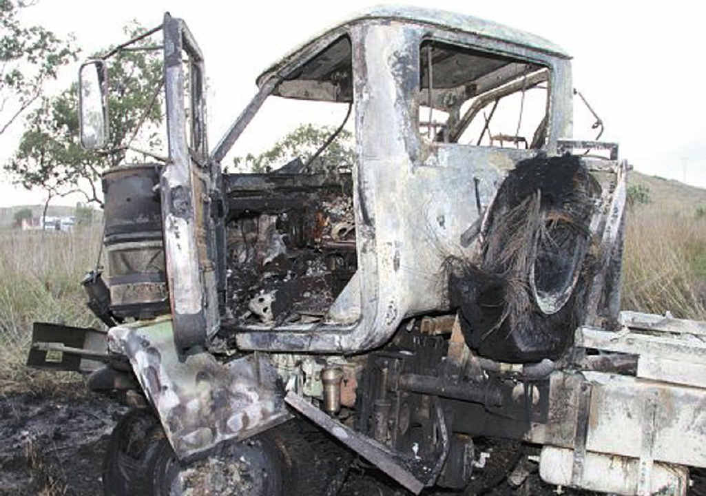 The burnt-out wreck of one truck after the crash on the Bruce Highway near Bajool. A woman died in a B-double. The burnt-out wreck of one truck after the crash on the Bruce Highway near Bajool. A woman died in a B-double.