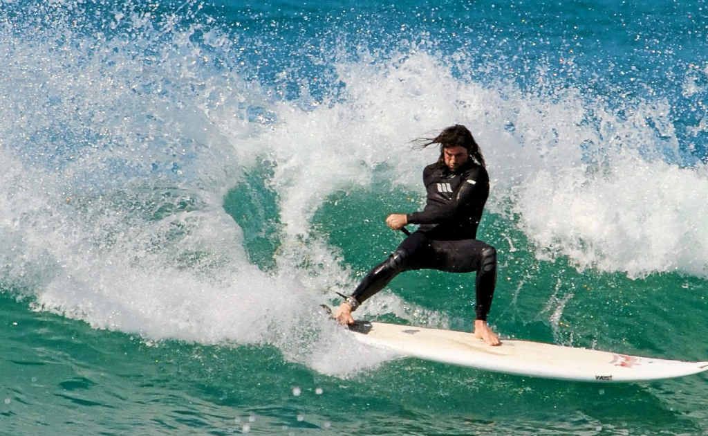 DIGGING IN: Roger Saunders carving up on home surf. Photo: Contributed / Daniel O’Sullivan DIGGING IN: Roger Saunders carving up on home surf. Photo: Contributed / Daniel O’Sullivan