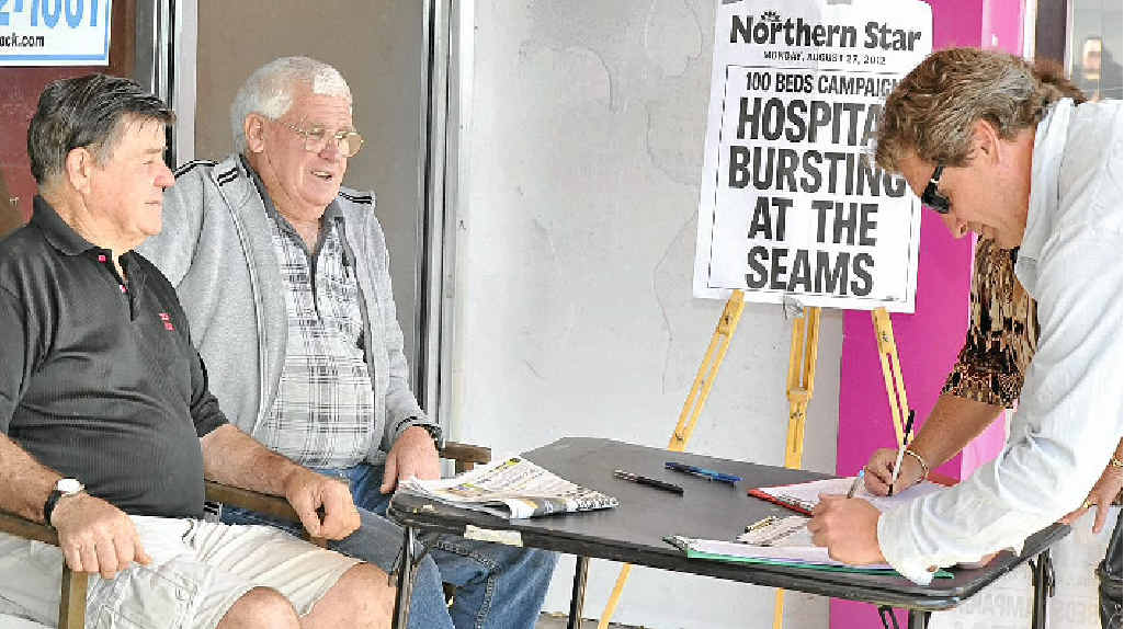 Marshall Fittler (left) and John Bigelow welcome Scott Marshall’s signature on their petition for more beds at the Lismore Base Hospital. Marshall Fittler (left) and John Bigelow welcome Scott Marshall’s signature on their petition for more beds at the Lismore Base Hospital.