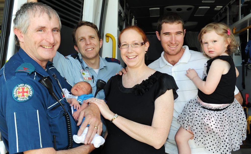 Ambulance delivery - Advance Care Paramedics Kevin Brand and Simon Knight reunite with the baby they delivered in the back of their ambulance. Baby Logan, Lucinda, Robin and Calista Van Bael of Mungar. Ambulance delivery - Advance Care Paramedics Kevin Brand and Simon Knight reunite with the baby they delivered in the back of their ambulance. Baby Logan, Lucinda, Robin and Calista Van Bael of Mungar.
