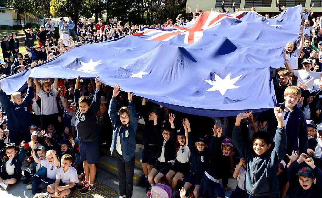 A huge Australian flag is the centre of attention at the Ipswich Central State School. A huge Australian flag is the centre of attention at the Ipswich Central State School.