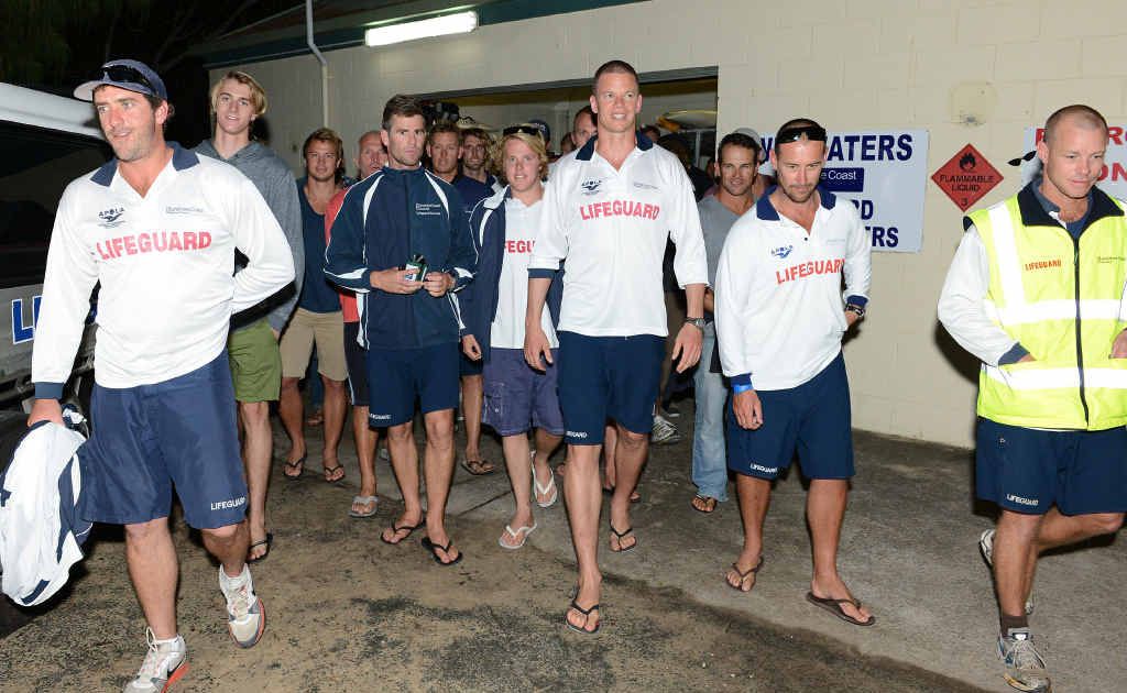 Lifeguards leave a workplace meeting . Lifeguards leave a workplace meeting .