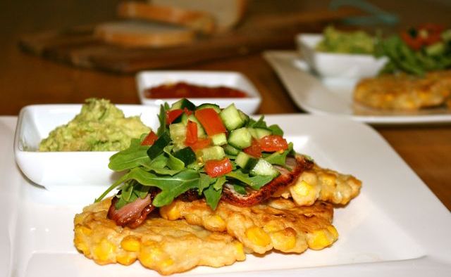 Miss Foodie's corn fritters with bacon, smashed avocado and salsa. Miss Foodie's corn fritters with bacon, smashed avocado and salsa.