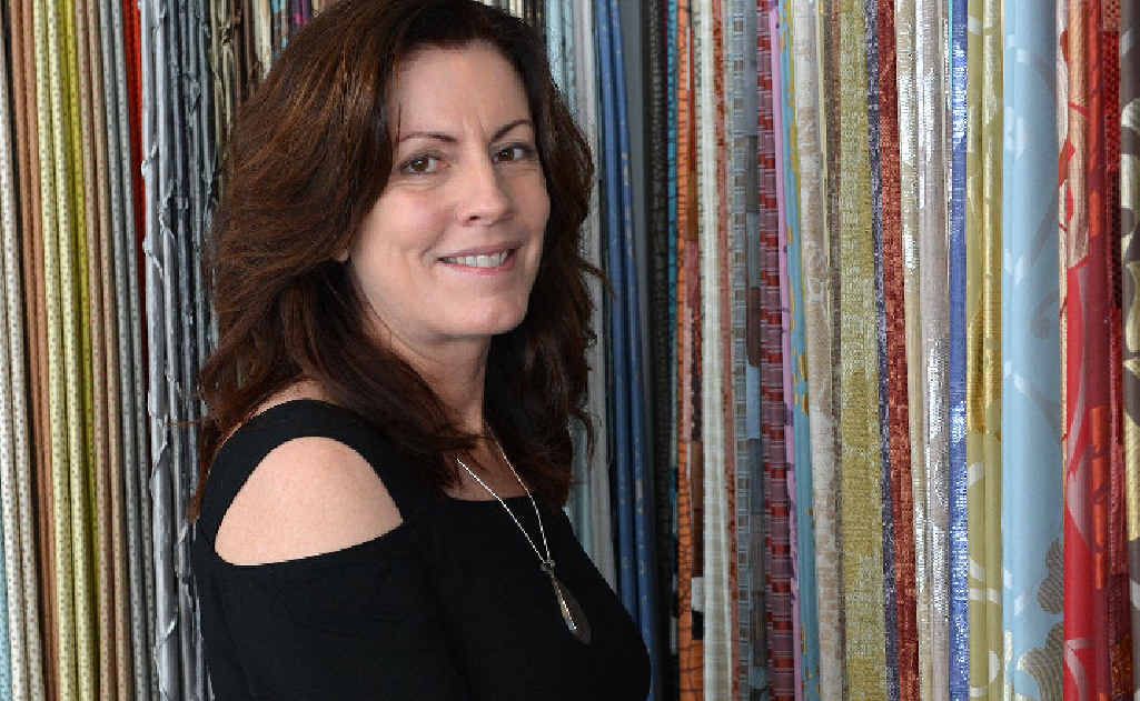 Robyn Jackson of Vision id Interior Design with some of her many fabric samples. Robyn Jackson of Vision id Interior Design with some of her many fabric samples.