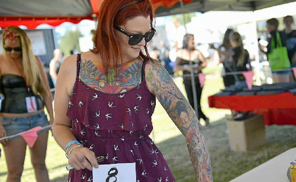 Megs Anderson shows off her tattoos to the judges at the Ink ‘n’ Chrome 2012 Car, Bike and Tattoo Show. Megs Anderson shows off her tattoos to the judges at the Ink ‘n’ Chrome 2012 Car, Bike and Tattoo Show.