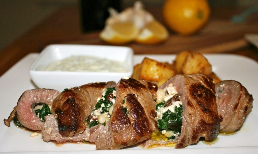Stuffed lamb loin with lemon potatoes and tzatziki. Stuffed lamb loin with lemon potatoes and tzatziki.