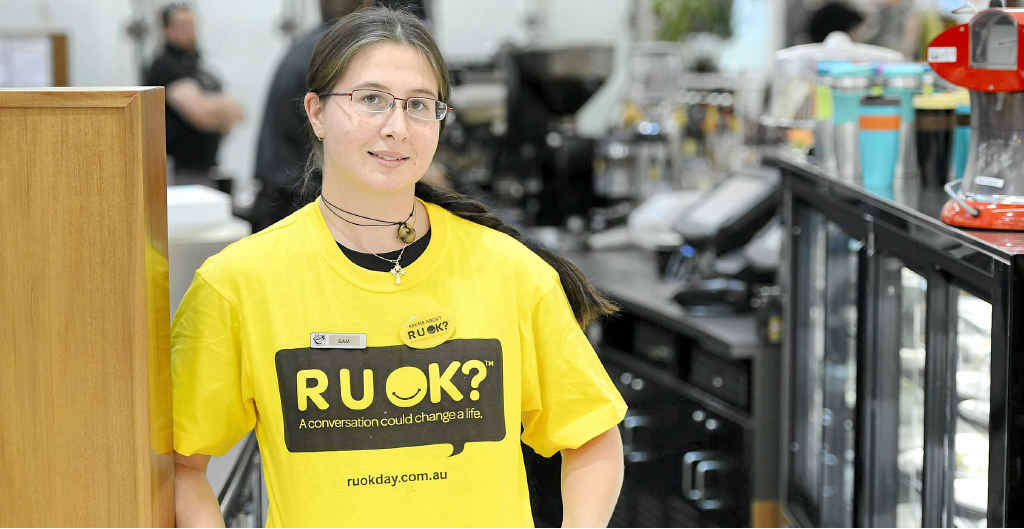 Samantha Wallace of Gloria Jean’s Grafton wears her R U OK T-shirt. Samantha Wallace of Gloria Jean’s Grafton wears her R U OK T-shirt.