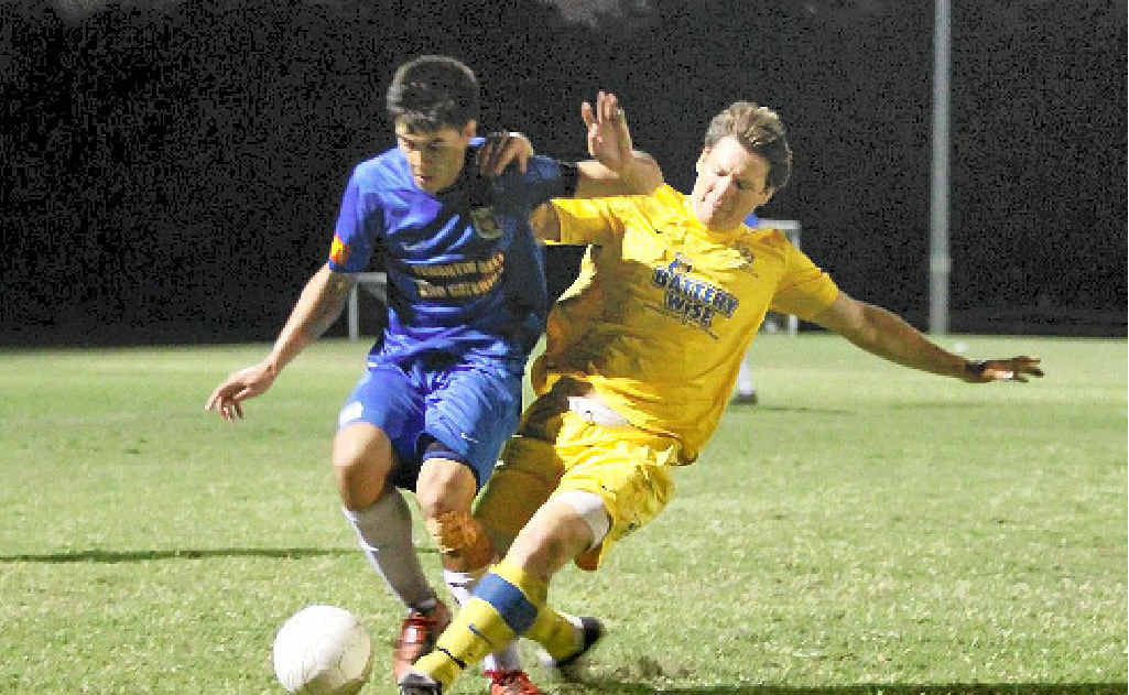 Noosa right-back Percey Cash is tackled late by Kawana’s Scott Rocker during the preliminary final. Noosa right-back Percey Cash is tackled late by Kawana’s Scott Rocker during the preliminary final.