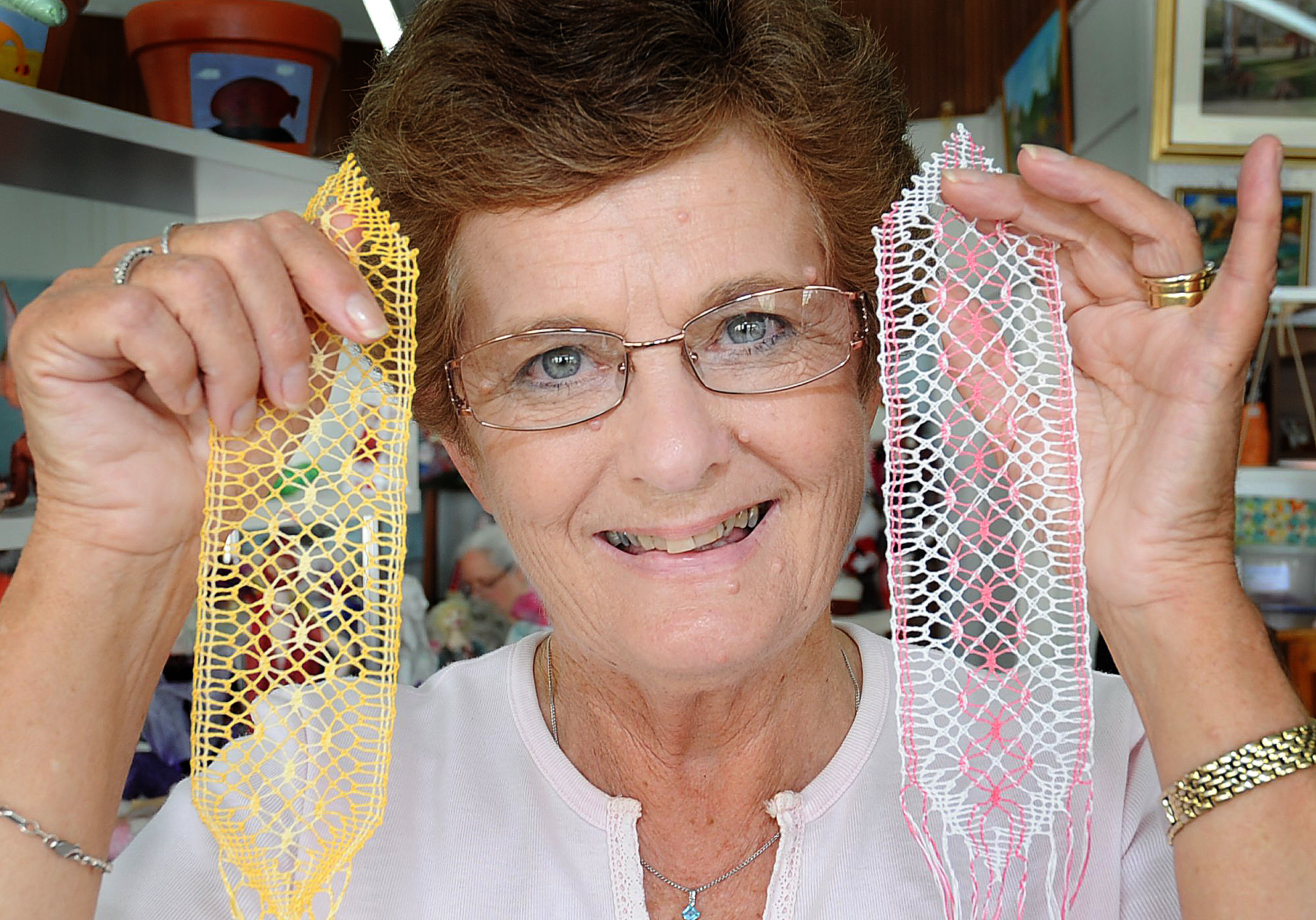 Bobbin lace-making group member Sue Gosewisch shows off some of the groups' creations. Bobbin lace-making group member Sue Gosewisch shows off some of the groups' creations.