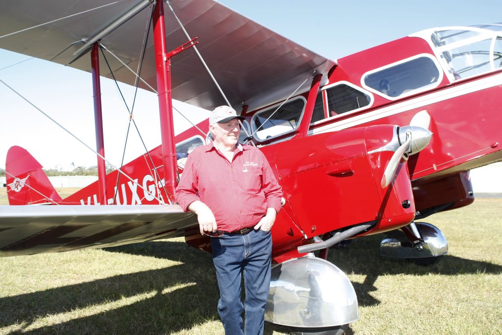 Des Porter with the restored bi-plane which was used in the 1930s by the Royal Flying Doctor Service, it is one of only four in the world. Photo: Nicola Brander / Caboolture News. Des Porter with the restored bi-plane which was used in the 1930s by the Royal Flying Doctor Service, it is one of only four in the world. Photo: Nicola Brander / Caboolture News.