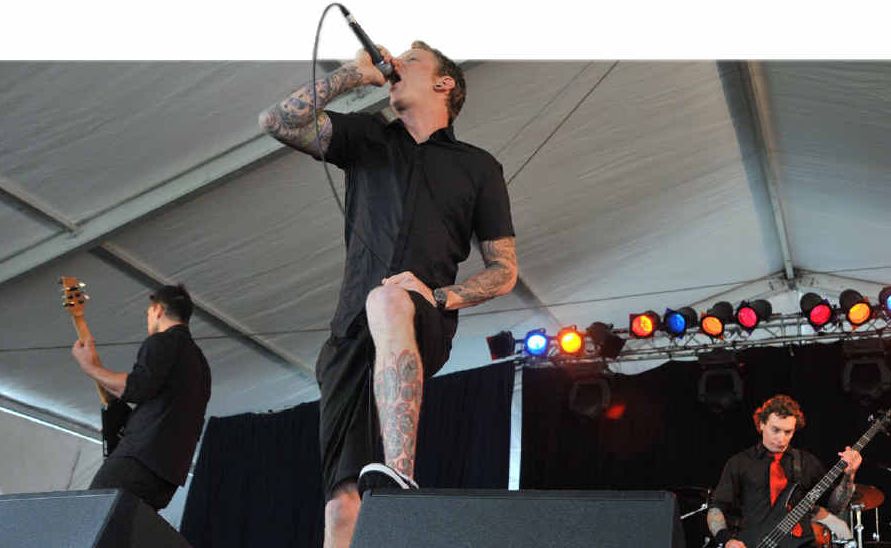 RED-TIE ROCK: Daniel Morcombe’s twin brother Dean (right and top left) performs with his band, Holistic, at the Family Day Out at Kings Beach, Caloundra. RED-TIE ROCK: Daniel Morcombe’s twin brother Dean (right and top left) performs with his band, Holistic, at the Family Day Out at Kings Beach, Caloundra.