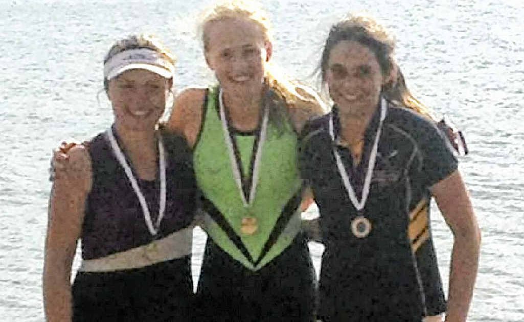 Harriet Hudson (centre) after a state title victory in rowing at Bundaberg. Harriet Hudson (centre) after a state title victory in rowing at Bundaberg.