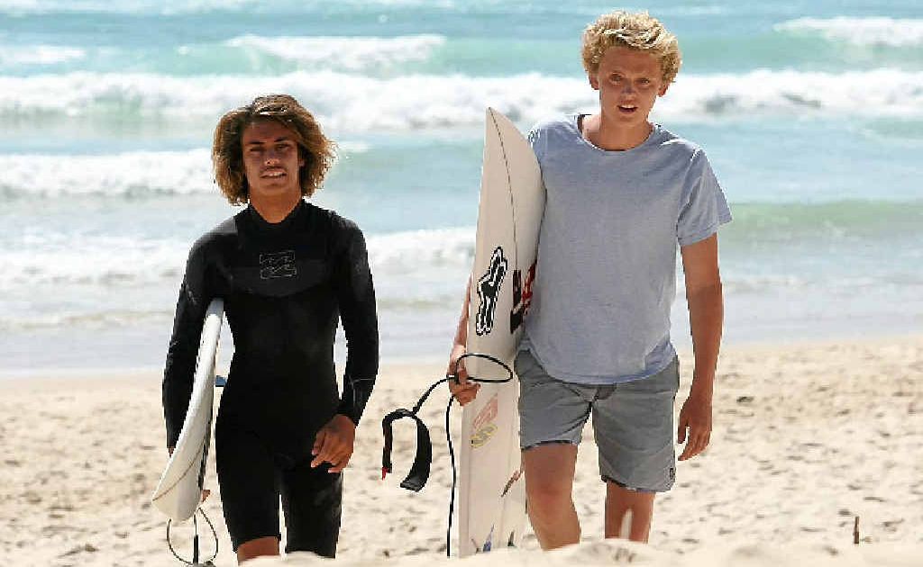 WAVE OF SUPPORT: Dylan Crawford (left) and mate Josh Atkins at Duranbah Beach. Photo Blainey Woodham / Daily News WAVE OF SUPPORT: Dylan Crawford (left) and mate Josh Atkins at Duranbah Beach. Photo Blainey Woodham / Daily News