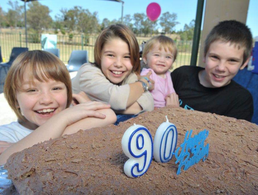 The Patterson siblings - (from left) Kelsea, Kayecee, Kareena and Kody - share The Smith Family's 90th birthday cake.