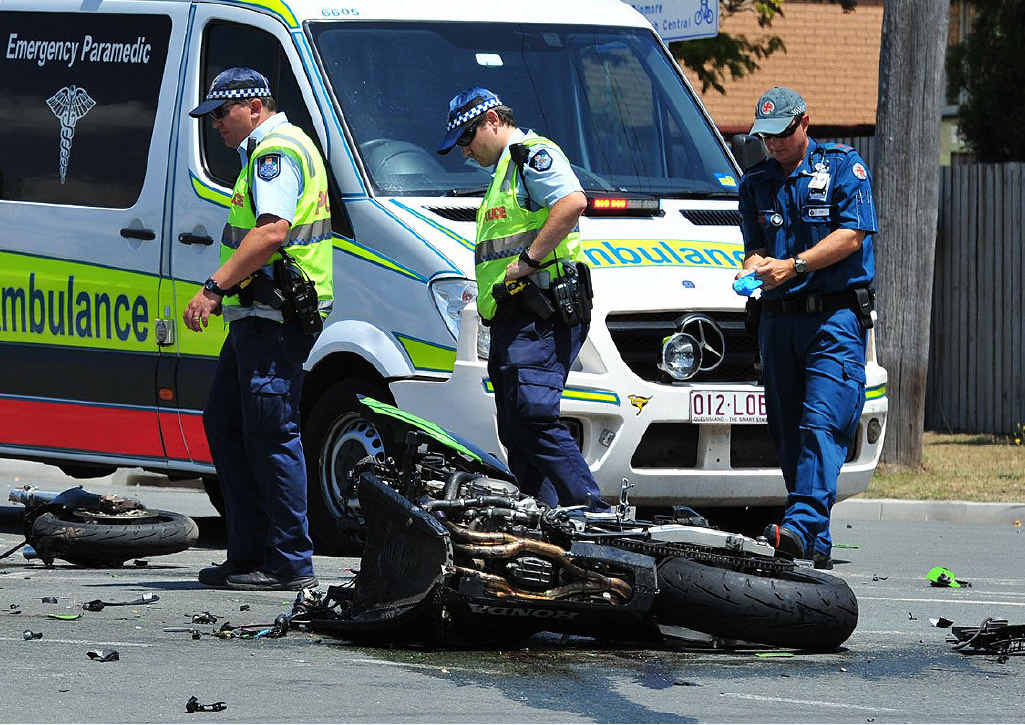 Police and ambulance officers examine the crash site. Police and ambulance officers examine the crash site.