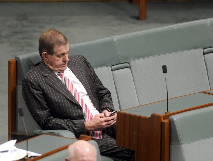 Peter Slipper sends text messages from his phone during Parliament. Peter Slipper sends text messages from his phone during Parliament.