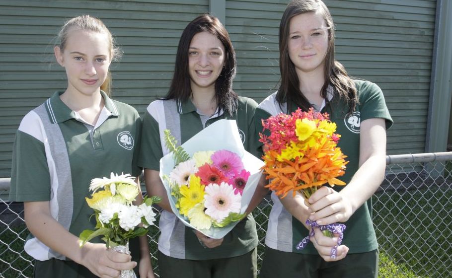 Ashleigh Tyler, Brittney Reibelt and Adair Scully-Schild bring flowers to school to lay in the paddock for the Caboolture High School alpacas that were beaten to the point of death on Saturday morning. Ashleigh Tyler, Brittney Reibelt and Adair Scully-Schild bring flowers to school to lay in the paddock for the Caboolture High School alpacas that were beaten to the point of death on Saturday morning.