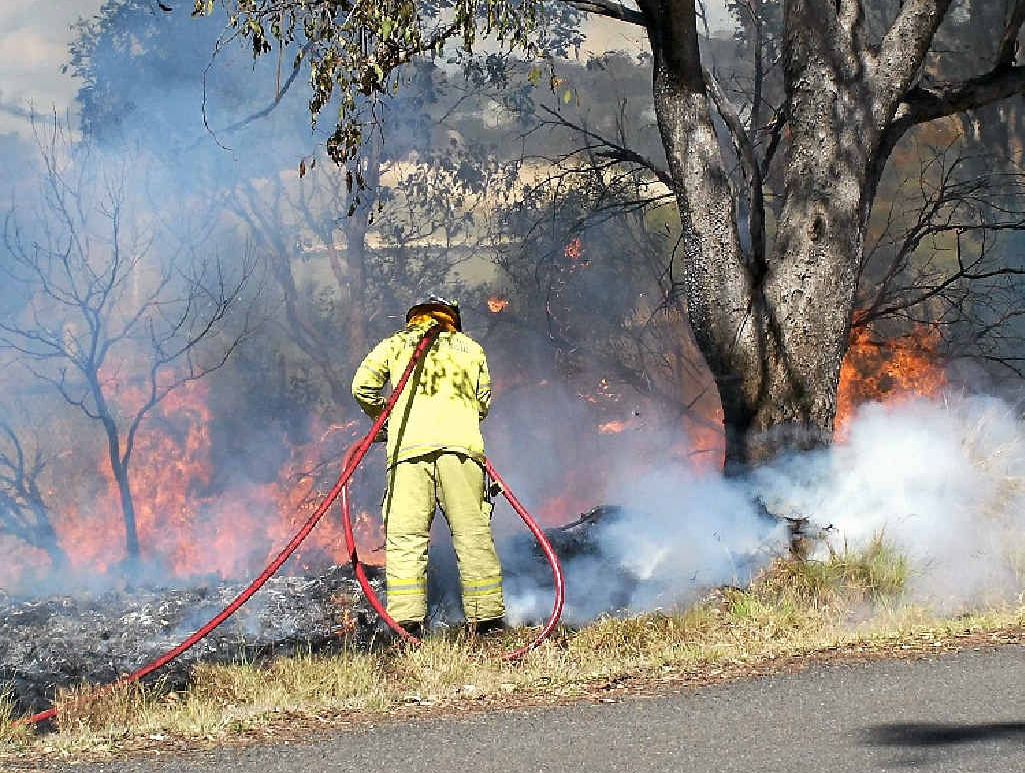 A firefighter battles a blaze in Willi St yesterday.