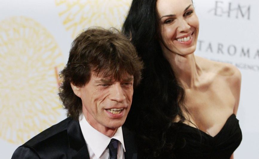 Mick Jagger flanked by his girlfriend L'Wren Scott arrive at a grand-gala ball on the occasion of Italian fashion designer Valentino 45th anniversary celebrations. Mick Jagger flanked by his girlfriend L'Wren Scott arrive at a grand-gala ball on the occasion of Italian fashion designer Valentino 45th anniversary celebrations.
