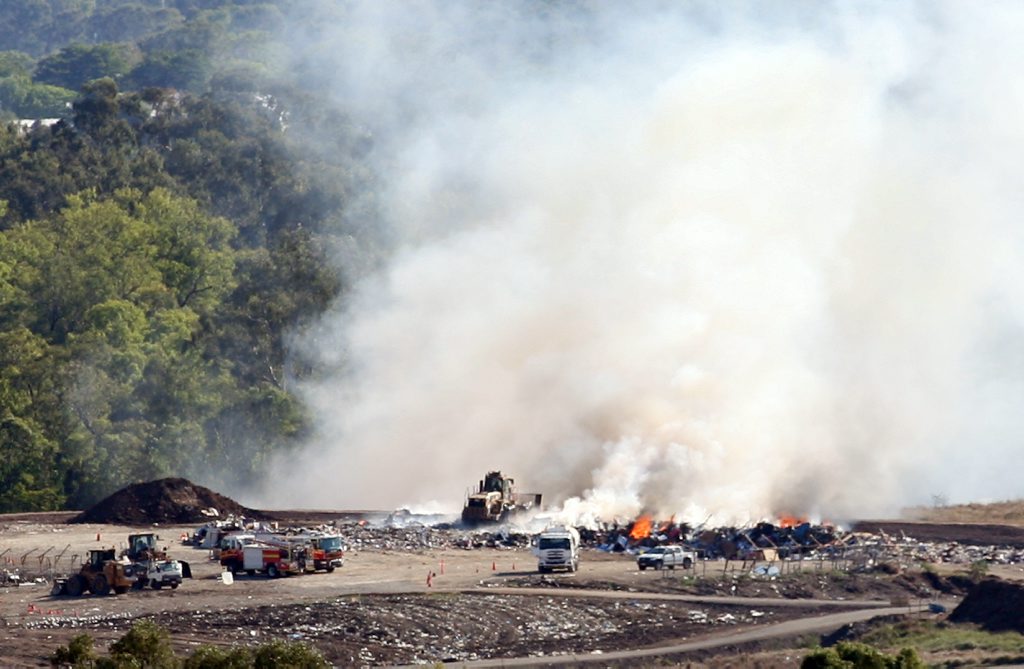 Fire fighters were called to the Lakes Creek Road rubbish dump after it caught fire. Photo: Chris Ison / The Morning Bulletin Fire fighters were called to the Lakes Creek Road rubbish dump after it caught fire. Photo: Chris Ison / The Morning Bulletin