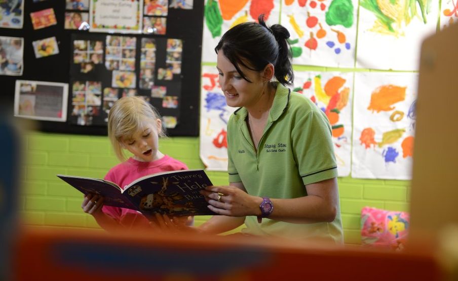 Stepping Stones director Heather Curran listens to Lily Dykstra, 4, read a book. Stepping Stones director Heather Curran listens to Lily Dykstra, 4, read a book.