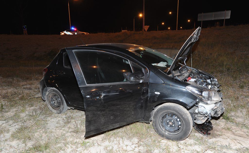 The driver of this Toyota Yaris, abandoned in the middle of the main roundabout on the Hervey Bay-Maryborough Rd intersection with Booral Rd, was apprehended by police in nearby bushland. The driver of this Toyota Yaris, abandoned in the middle of the main roundabout on the Hervey Bay-Maryborough Rd intersection with Booral Rd, was apprehended by police in nearby bushland.
