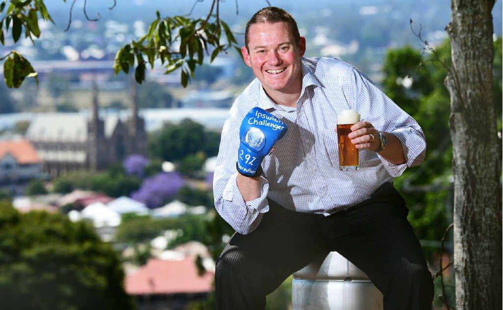Local brewer Wade Curtis with his new mid-strength beer the Ipswich Challenger. Local brewer Wade Curtis with his new mid-strength beer the Ipswich Challenger.