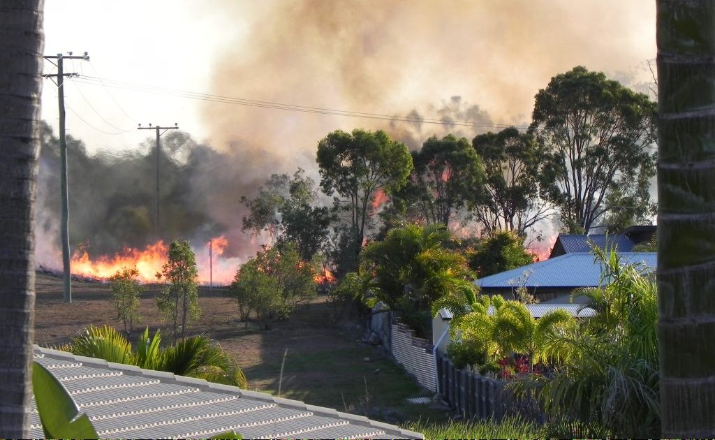 A fire at Tannum Sands yesterday afternoon came close to houses. A fire at Tannum Sands yesterday afternoon came close to houses.