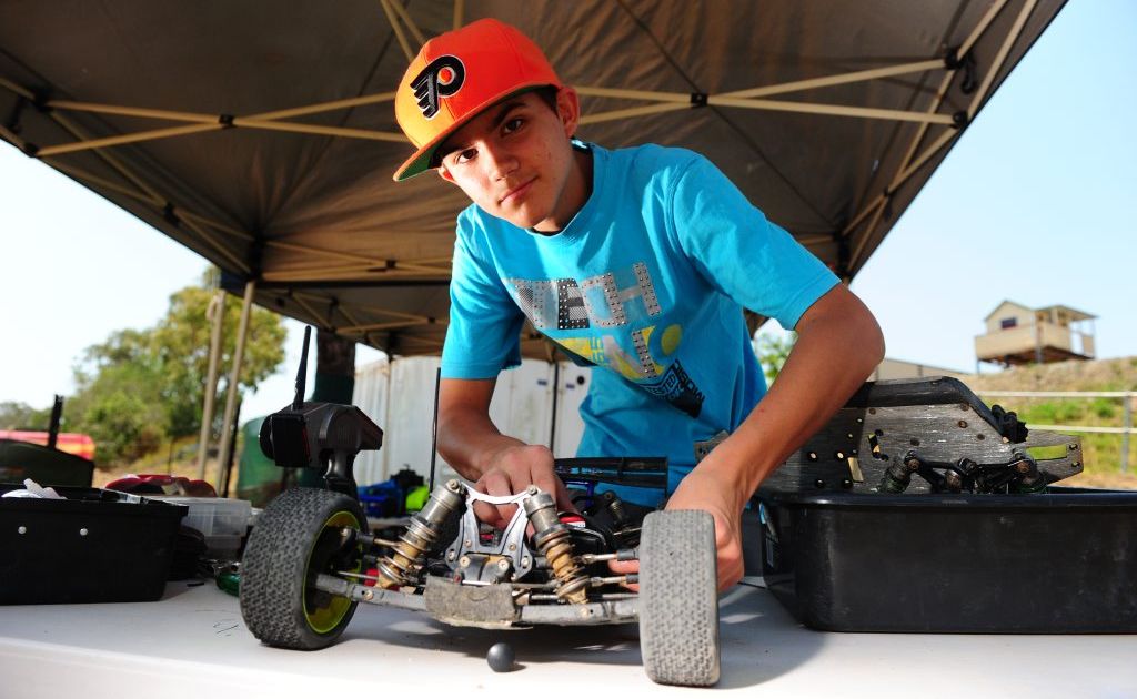 Jay Lanzon, 14, works on his vehicle at the Gladstone Radio Controlled Car Club meet at Glenlyon Rd. Jay Lanzon, 14, works on his vehicle at the Gladstone Radio Controlled Car Club meet at Glenlyon Rd.