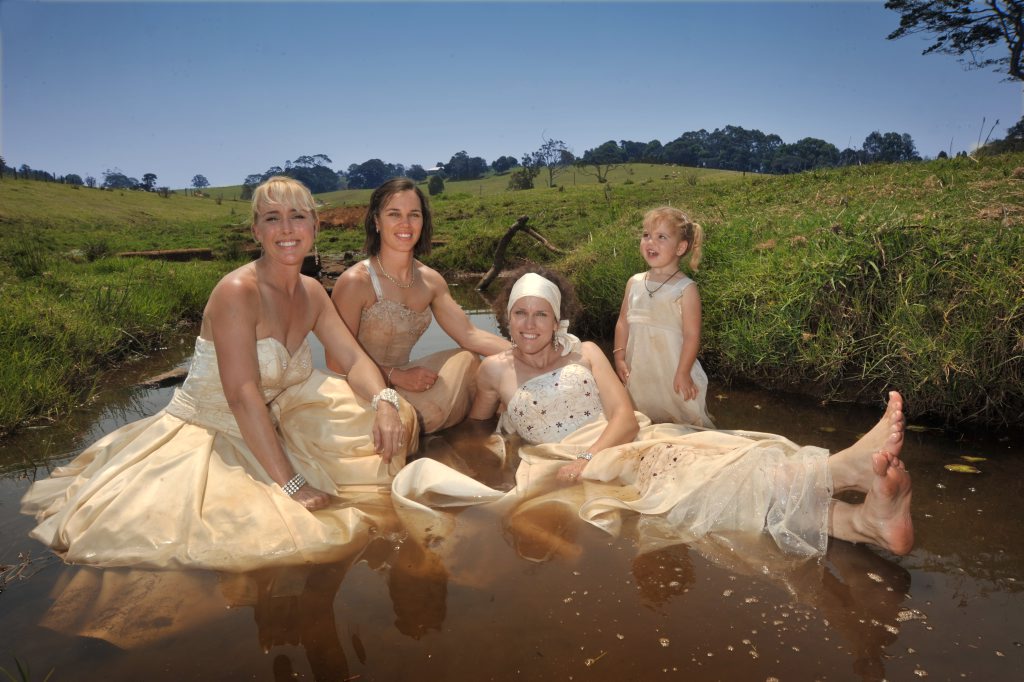 Brides Get Down And Dirty For Wedding Dress Trashing Record Trash Your Wedding Dress Fundraiser At Maleny Dairy Getting Down And Dirty In The Creek