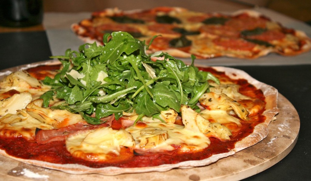 Miss Foodie's ham and artichoke pizza topped with rocket and parmesan salad. Miss Foodie's ham and artichoke pizza topped with rocket and parmesan salad.