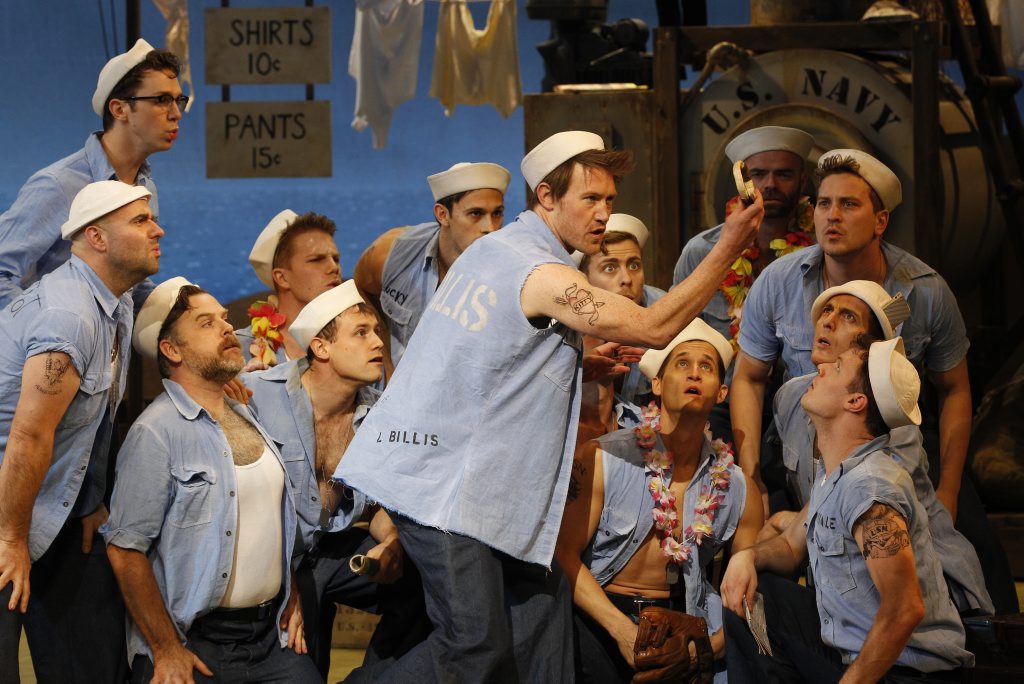 Eddie Perfect (centre) in a scene from the musical South Pacific. Eddie Perfect (centre) in a scene from the musical South Pacific.