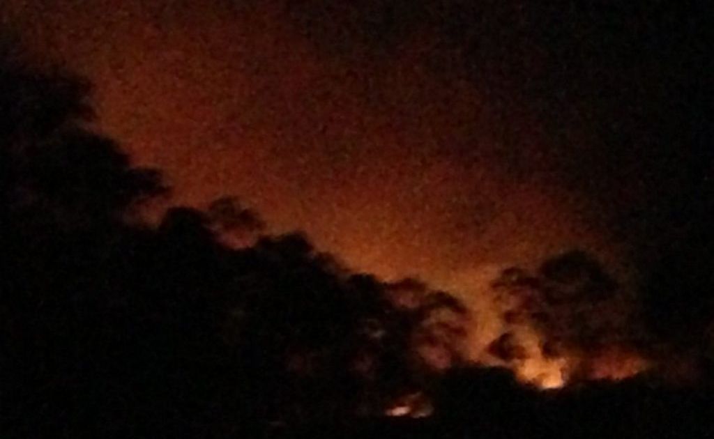 This photo by Naomi Booth, Burua, shows the glow from the Beecher fire. This photo by Naomi Booth, Burua, shows the glow from the Beecher fire.