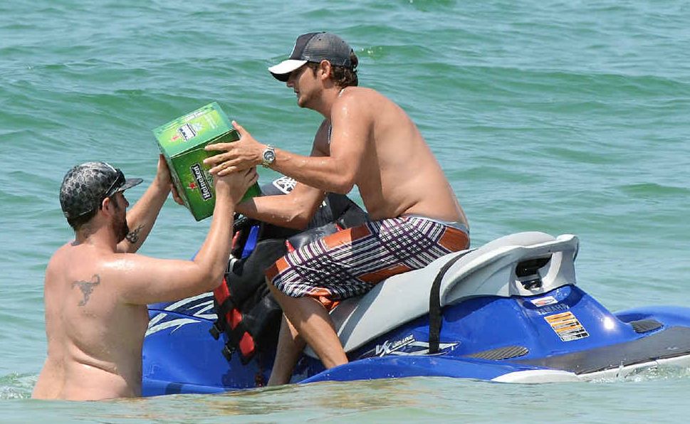 The jet ski launches off the beach. The jet ski launches off the beach.