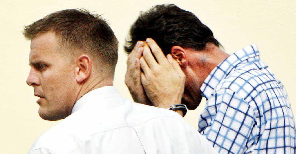 KILLER: Chris Swan (right) accompanied by an Ipswich detective. KILLER: Chris Swan (right) accompanied by an Ipswich detective.