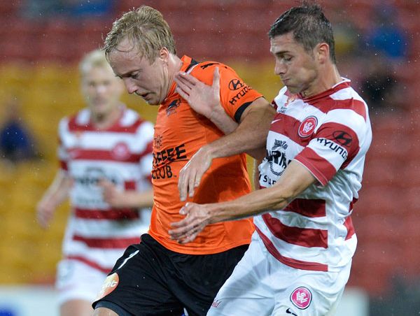 Mitchell Nichols of the Roar and Mateo Poljak of the Wanderers challenge for the ball during the round four A-League match between the Brisbane Roar and the Western Sydney Wanderers FC. Mitchell Nichols of the Roar and Mateo Poljak of the Wanderers challenge for the ball during the round four A-League match between the Brisbane Roar and the Western Sydney Wanderers FC.