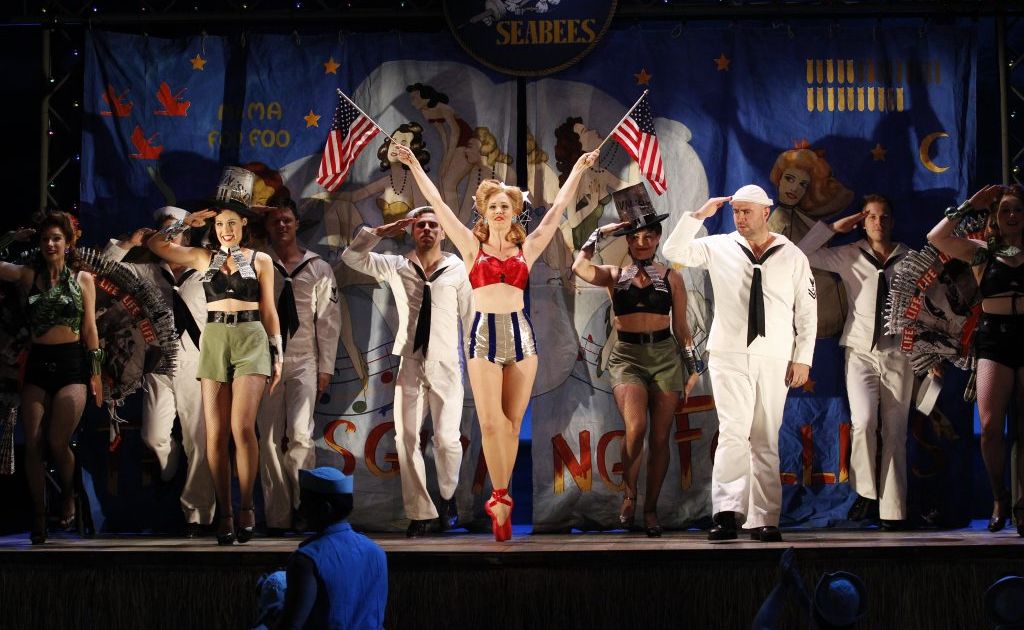The ensemble cast in a scene from the musical South Pacific. The ensemble cast in a scene from the musical South Pacific.