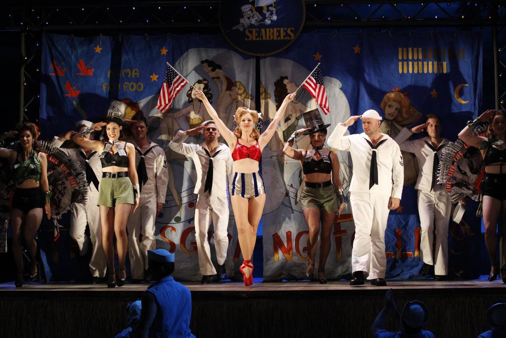 The ensemble cast in a scene from the musical South Pacific. The ensemble cast in a scene from the musical South Pacific.