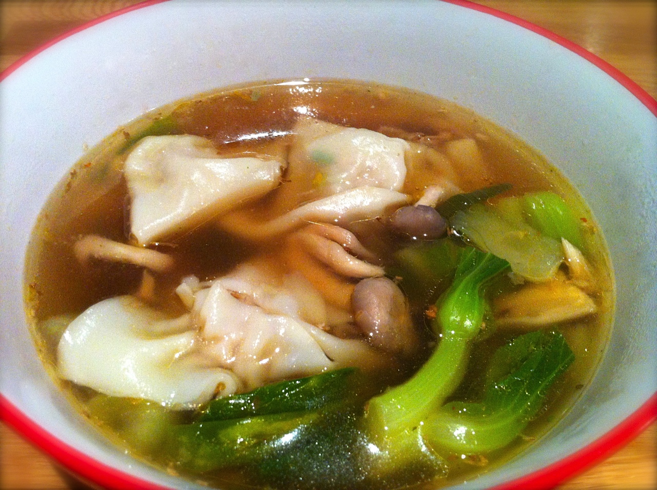 Miss Foodie's wonton soup w/ Asian mushrooms and bok choy. Miss Foodie's wonton soup w/ Asian mushrooms and bok choy.