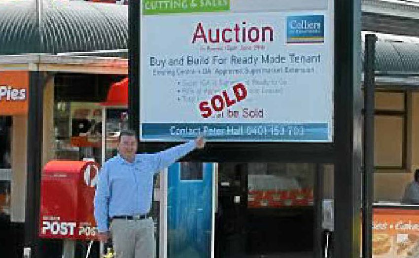 Colliers International commercial agent Peter Hall announces Withcott's IGA is back on. Colliers International commercial agent Peter Hall announces Withcott's IGA is back on.