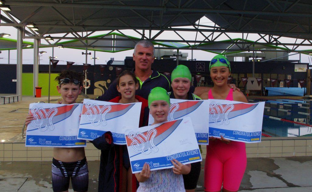 Richmond Valley Swim Club members (from left) Caleb Yourell, Rachel Redman, Tara Blunn, Aimee Landrigan and Chloe Gillet received Australian Junior Excellence Program awards from club coach Michael Freney (back). Photo Contributed Richmond Valley Swim Club members (from left) Caleb Yourell, Rachel Redman, Tara Blunn, Aimee Landrigan and Chloe Gillet received Australian Junior Excellence Program awards from club coach Michael Freney (back). Photo Contributed